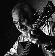 Martyn Wyndham-Reid with Guitar